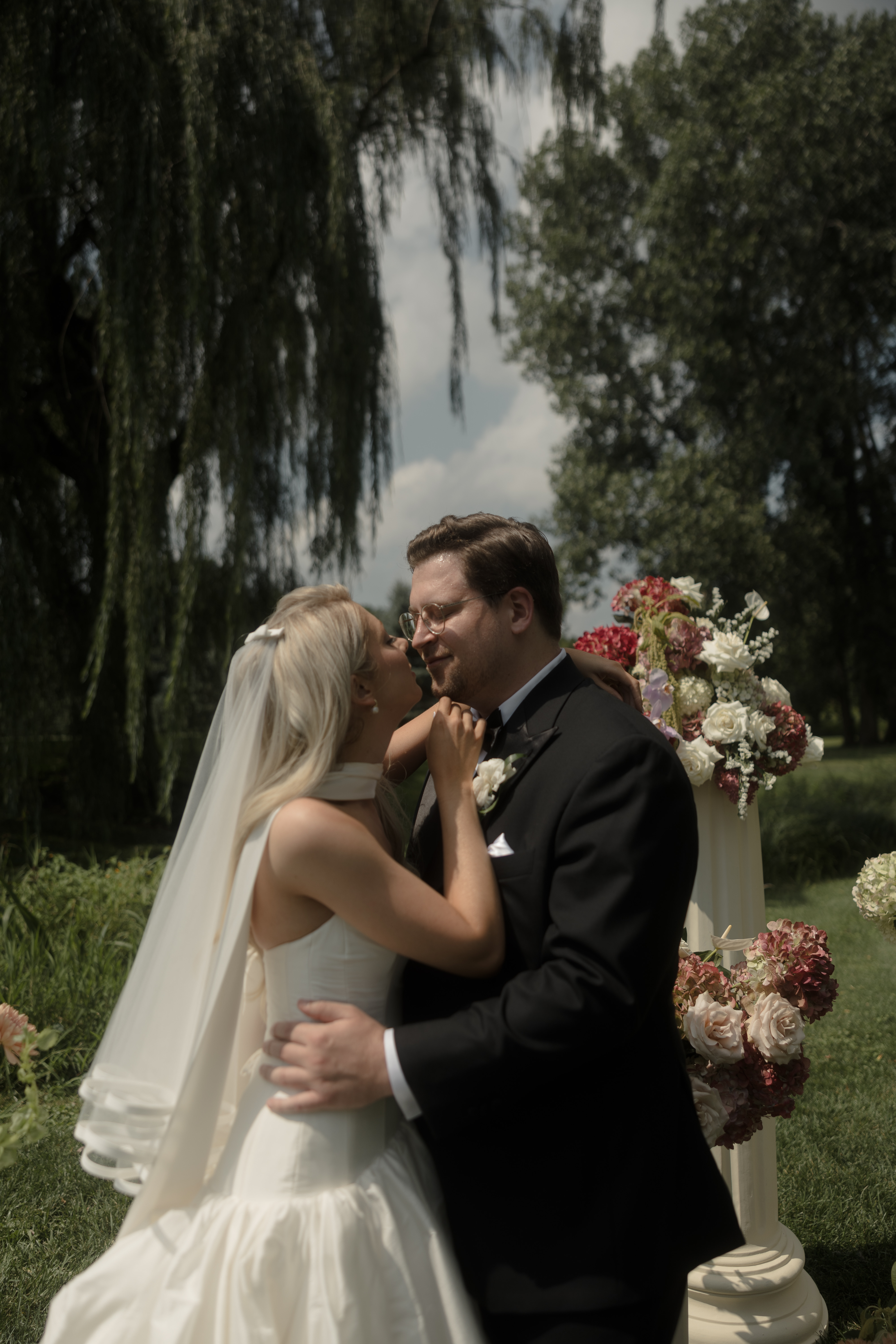 Bride and groom kiss at ceremony